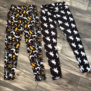 2 Pairs of Spirit Halloween Ghost and Bat Leggings. Selling both pairs together.